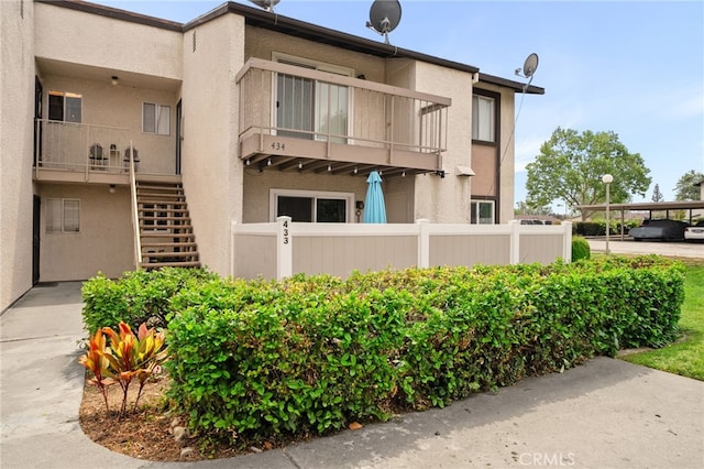8990 19th St Unit 433, Rancho Cucamonga, CA 91701 - exterior space with fence and stairs