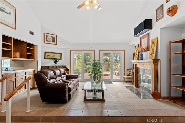 832 Onstott Rd, Lompoc, CA 93436 - living area with lofted ceiling, light tile patterned floors, visible vents, a premium fireplace, and a ceiling fan