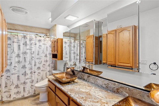 832 Onstott Rd, Lompoc, CA 93436 - bathroom featuring vanity, curtained shower, toilet, visible vents, and tile patterned flooring
