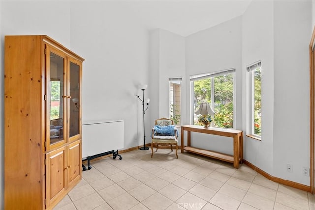 832 Onstott Rd, Lompoc, CA 93436 - sitting room with light tile patterned floors, a towering ceiling, and baseboards