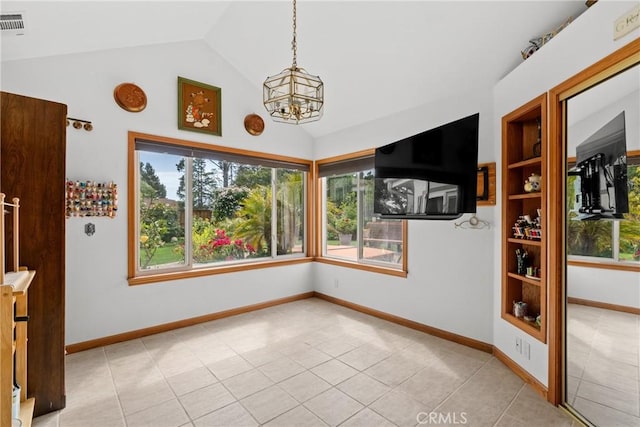 832 Onstott Rd, Lompoc, CA 93436 - unfurnished dining area with light tile patterned floors, an inviting chandelier, a wealth of natural light, and baseboards