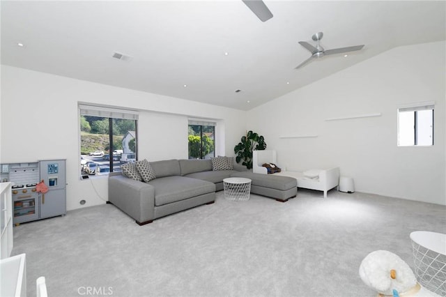 living room with carpet floors, a ceiling fan, visible vents, and lofted ceiling