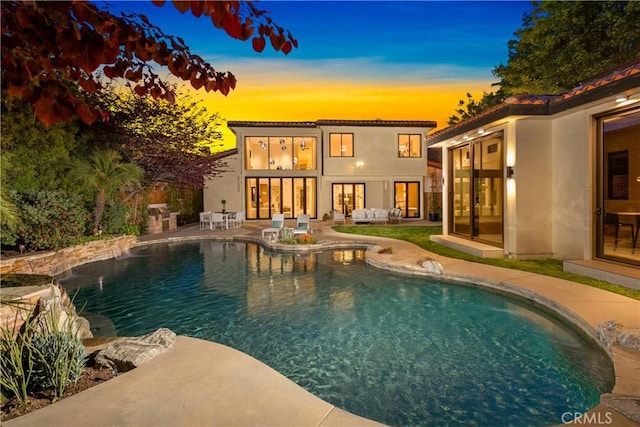 28 W La Sierra Dr, Arcadia, CA 91007 - pool at dusk featuring an outdoor living space, french doors, an outdoor pool, and a patio area
