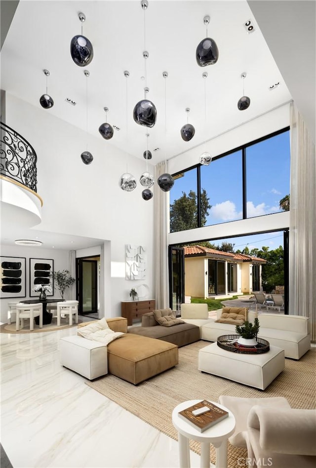 28 W La Sierra Dr, Arcadia, CA 91007 - living room with a healthy amount of sunlight, marble finish floor, and a towering ceiling