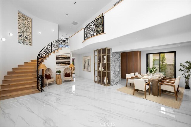28 W La Sierra Dr, Arcadia, CA 91007 - entryway with marble finish floor, a towering ceiling, and stairs