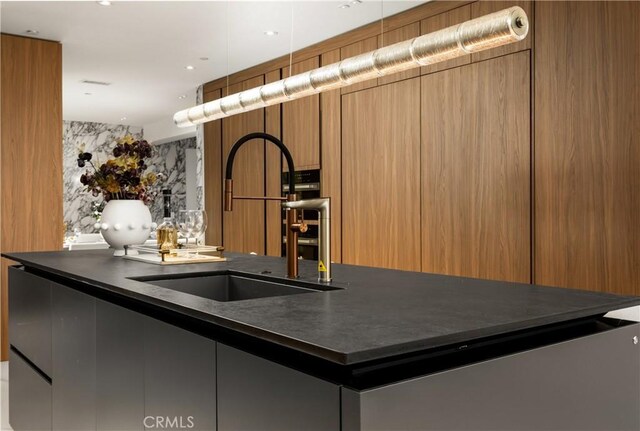 28 W La Sierra Dr, Arcadia, CA 91007 - kitchen featuring decorative light fixtures, dark countertops, a sink, and modern cabinets