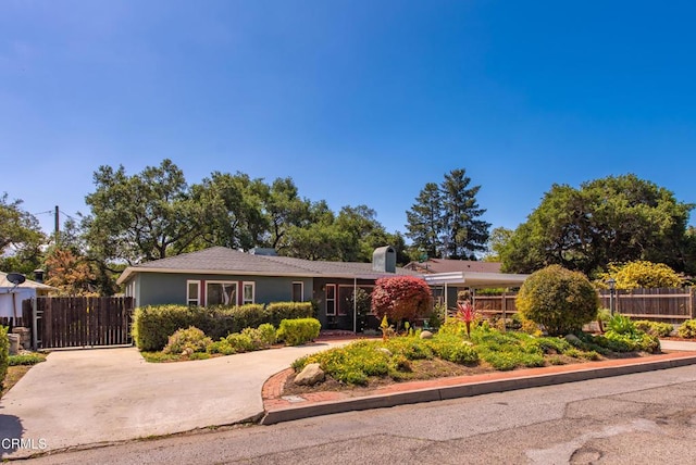 ranch-style home with fence and a chimney