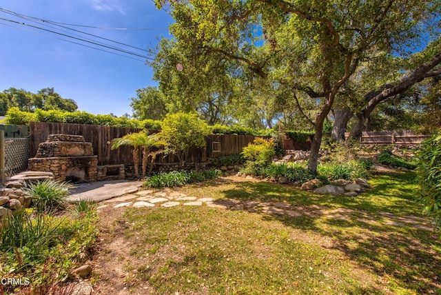 view of yard with a fenced backyard