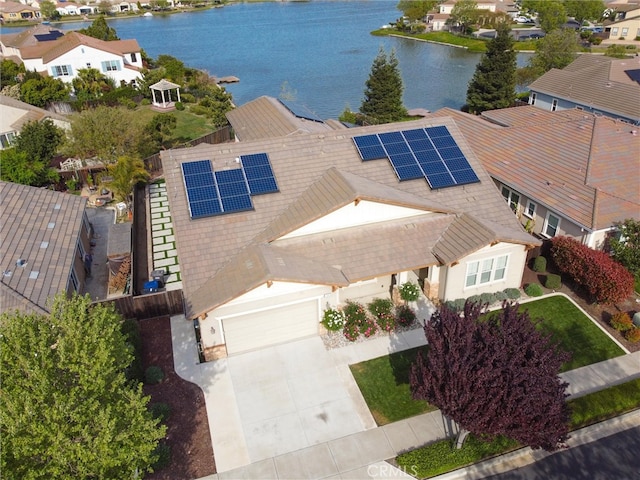 bird's eye view featuring a water view and a residential view