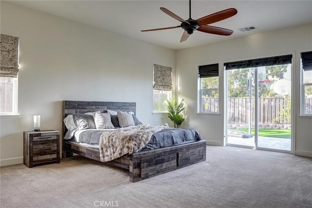 bedroom featuring carpet, visible vents, access to exterior, and baseboards