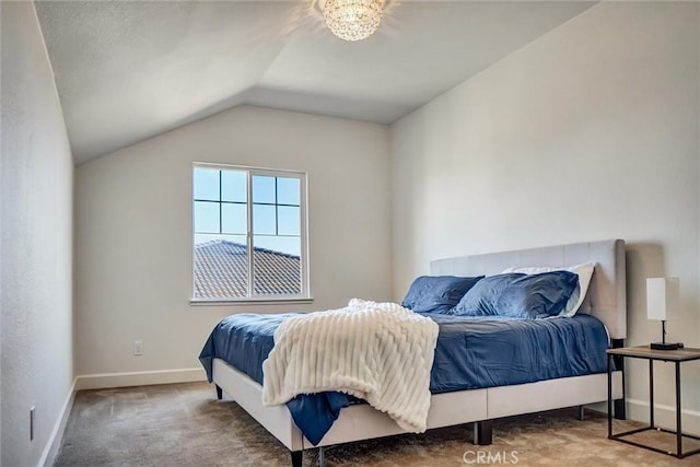 bedroom featuring vaulted ceiling, carpet floors, and baseboards