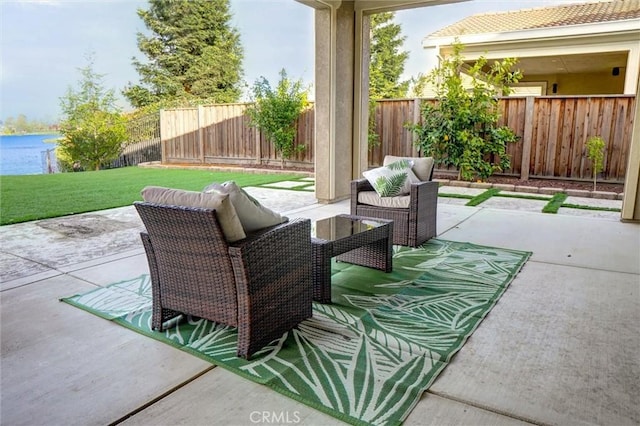 view of patio / terrace featuring an outdoor living space and a fenced backyard
