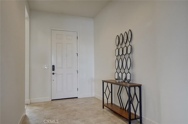 entryway featuring baseboards
