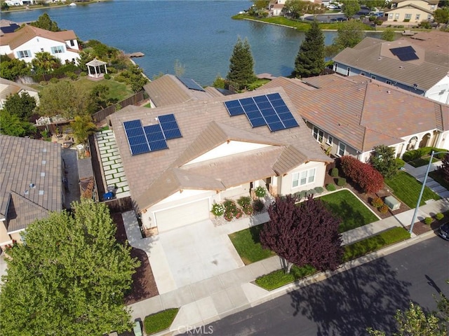 bird's eye view with a residential view and a water view