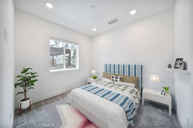 carpeted bedroom with recessed lighting, visible vents, and baseboards