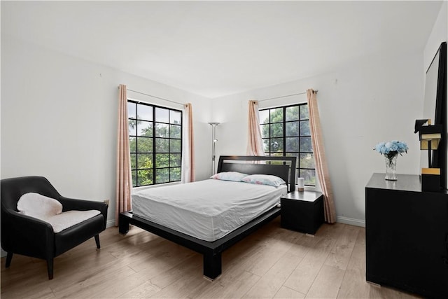 1029 S Reservoir St, Pomona, CA 91766 - bedroom featuring baseboards and light wood-style flooring