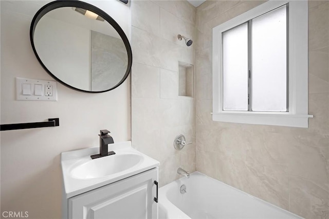 full bathroom featuring vanity and  shower combination
