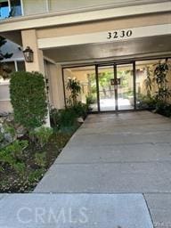 property entrance featuring french doors