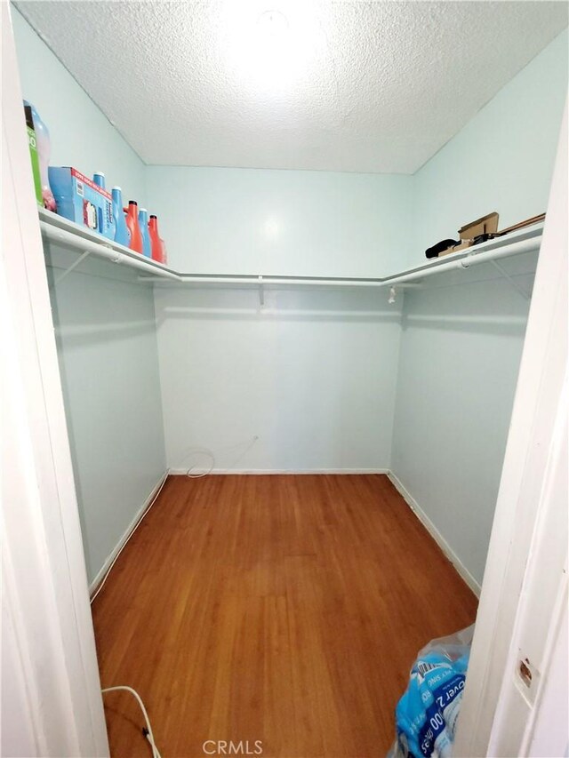 17762 Palo Verde Ave, Cerritos, CA 90703 - walk in closet featuring wood finished floors