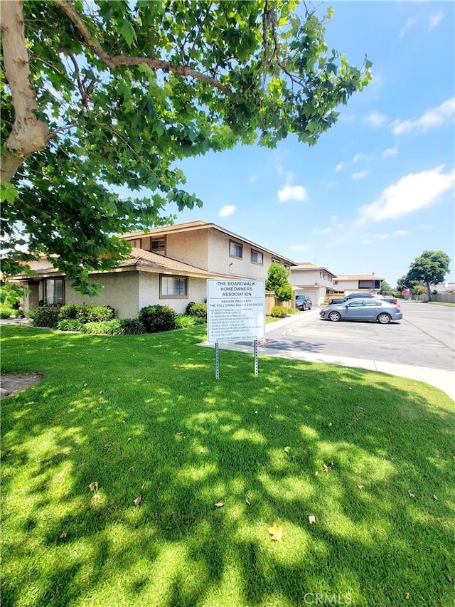17762 Palo Verde Ave, Cerritos, CA 90703 - view of front of home with a front lawn and stucco siding