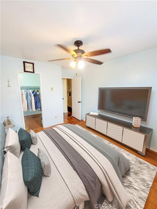 17762 Palo Verde Ave, Cerritos, CA 90703 - bedroom with a spacious closet, ceiling fan, and wood finished floors