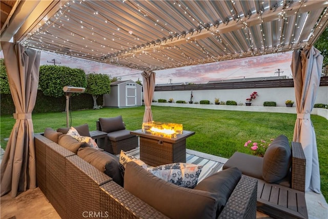 view of patio with an outdoor living space with a fire pit, an outdoor structure, a water view, and a shed