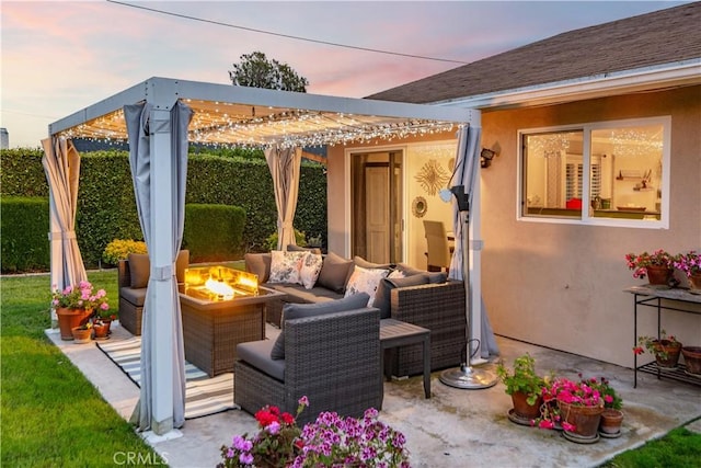 patio terrace at dusk featuring an outdoor living space with a fire pit and a pergola