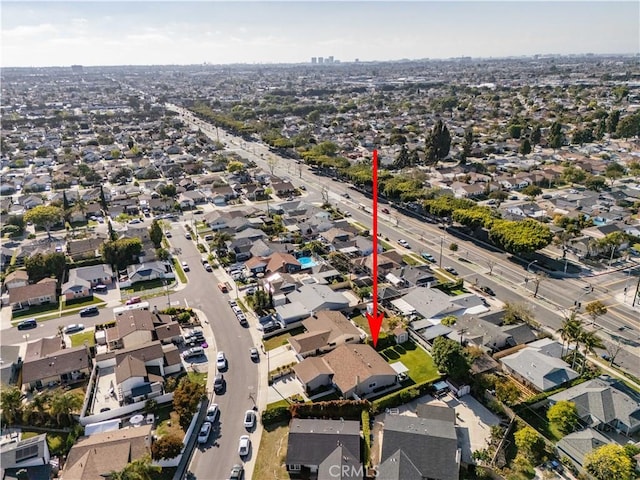 birds eye view of property with a residential view