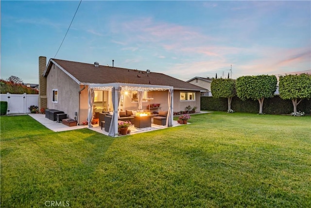 rear view of house featuring a lawn, an outdoor hangout area, a fenced backyard, a pergola, and stucco siding