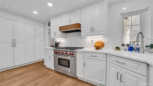 2617 Huntington Ln Unit B, Redondo Beach, CA 90278 - kitchen featuring premium range, premium range hood, white cabinets, recessed lighting, and light countertops