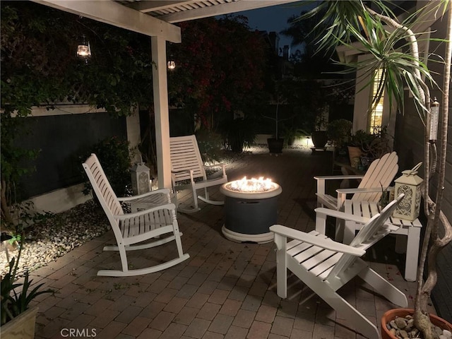 2617 Huntington Ln Unit B, Redondo Beach, CA 90278 - patio at twilight with an outdoor fire pit, a pergola, and a patio