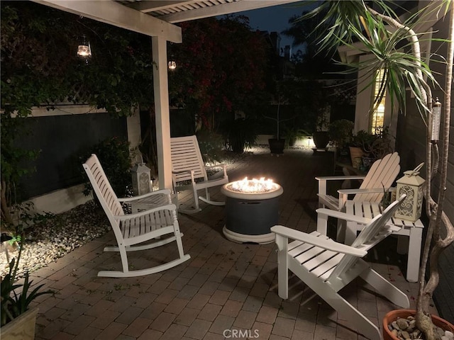 2617 Huntington Ln Unit B, Redondo Beach, CA 90278 - patio at twilight featuring a fire pit, a pergola, and a patio area