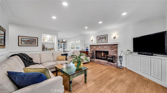 2617 Huntington Ln Unit B, Redondo Beach, CA 90278 - living area with ornamental molding, light wood-style floors, a fireplace, ceiling fan, and recessed lighting