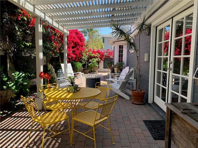 2617 Huntington Ln Unit B, Redondo Beach, CA 90278 - view of patio with a pergola, french doors, and outdoor dining area