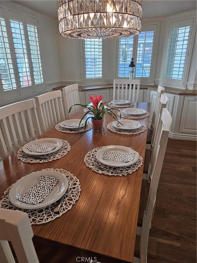 2617 Huntington Ln Unit B, Redondo Beach, CA 90278 - dining room featuring a decorative wall, dark wood-type flooring, a chandelier, and wainscoting