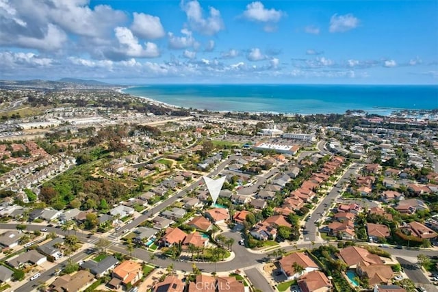 birds eye view of property with a residential view and a water view
