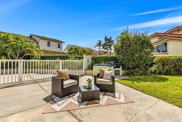view of patio / terrace with fence and an outdoor living space