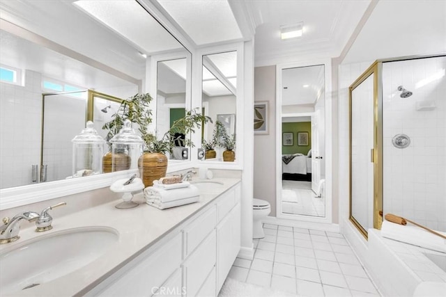 bathroom featuring connected bathroom, tile patterned floors, a shower stall, and a sink