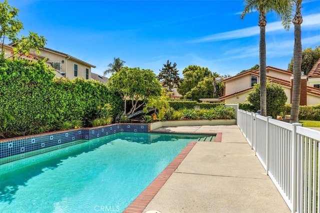 view of swimming pool featuring a fenced in pool and fence