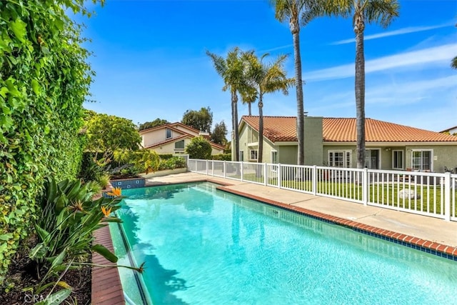 view of swimming pool with a fenced in pool and fence