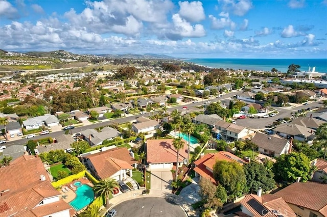 birds eye view of property featuring a water view and a residential view
