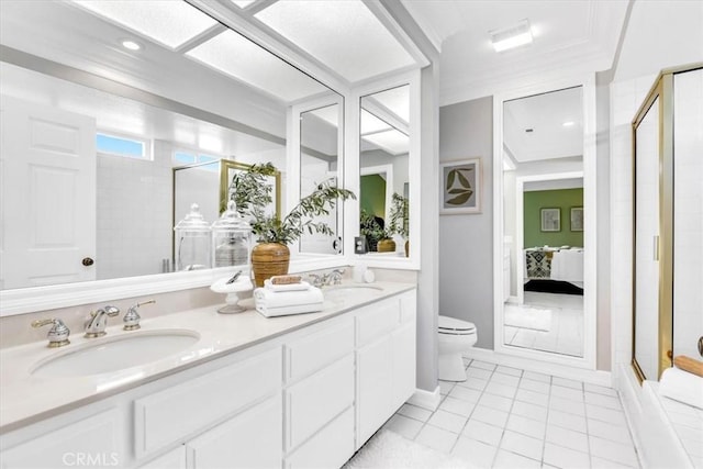 bathroom with a sink, connected bathroom, toilet, and a shower stall