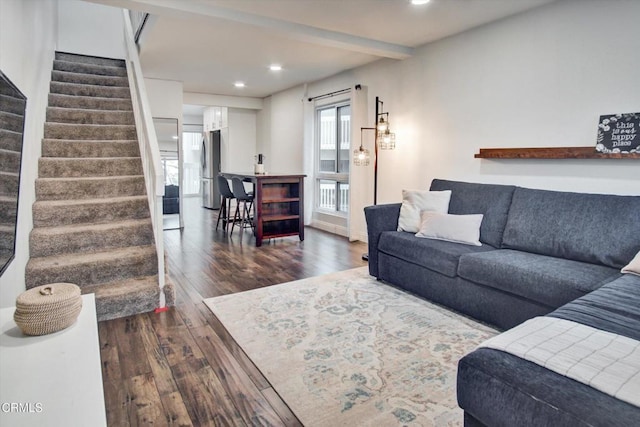 living area with stairway, recessed lighting, and dark wood-style flooring