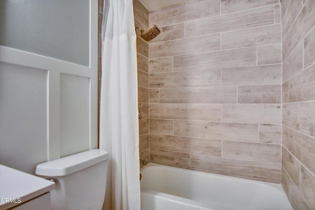 full bath with toilet and shower / tub combo with curtain