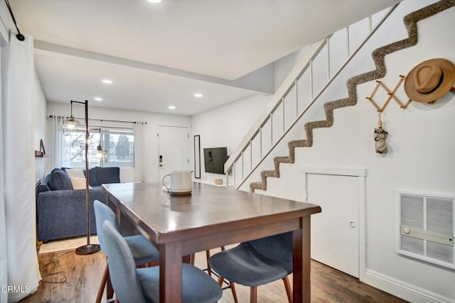 dining area with visible vents, wood finished floors, stairway, baseboards, and recessed lighting