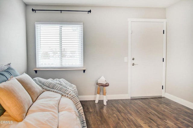 living room with baseboards and wood finished floors