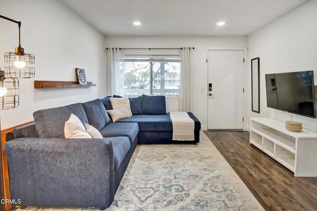 living area featuring recessed lighting and dark wood-type flooring