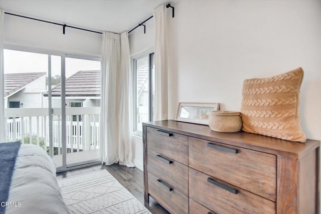doorway to outside featuring plenty of natural light and wood finished floors