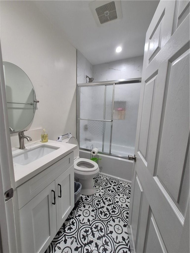 4911 S Wilton Pl, Los Angeles, CA 90062 - bathroom featuring vanity, shower / bath combination with glass door, and tile patterned floors