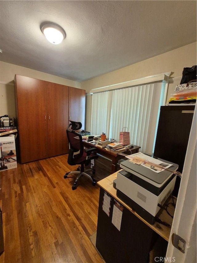 4911 S Wilton Pl, Los Angeles, CA 90062 - office area with wood finished floors and a textured ceiling